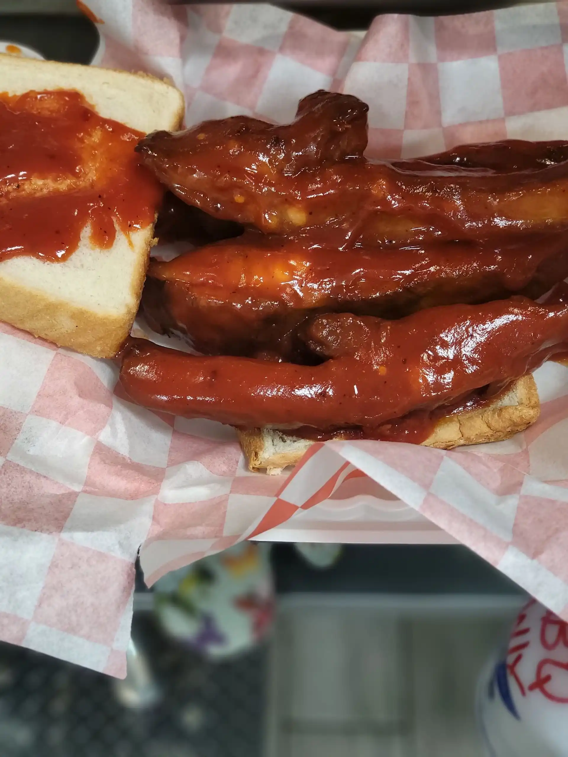 BBQ ribs with sauce on white bread